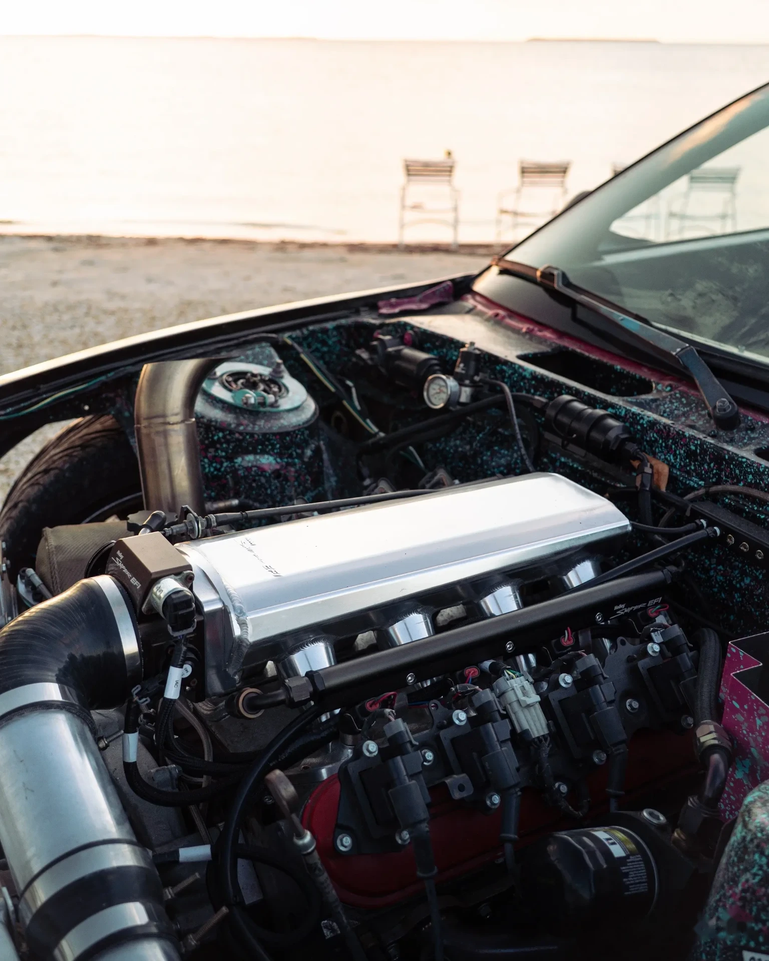 Silvia engine bay with beach and horizon behind